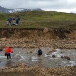 Crossing River in Iceland Mountains