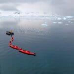 Red Color Boat In Antarctica Ice Climbing